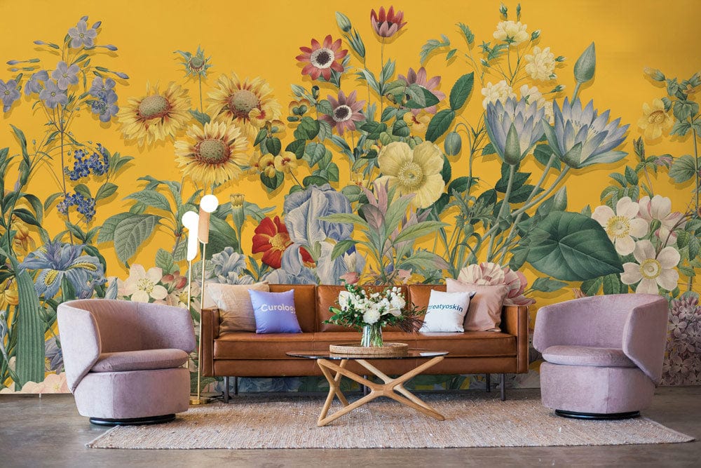Vibrant Floral Symphony mural; yellow botanical wallpaper, stylish interior, brown sofa, purple chairs, modern lamp.