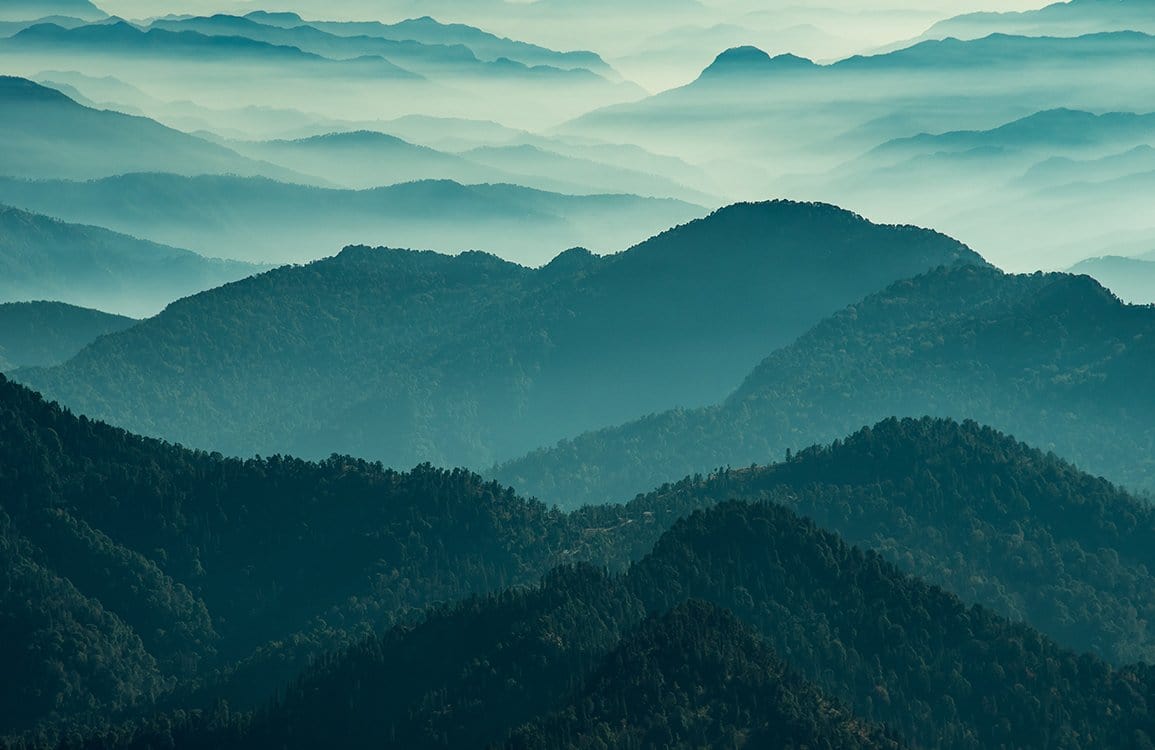Serene Misty Green Mountain Landscape Mural Wallpaper for Tranquil Spaces