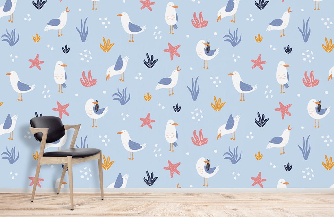 Children's room with Coastal Seagull Starfish wallpaper, wooden flooring, modern chair. Blue ocean theme.