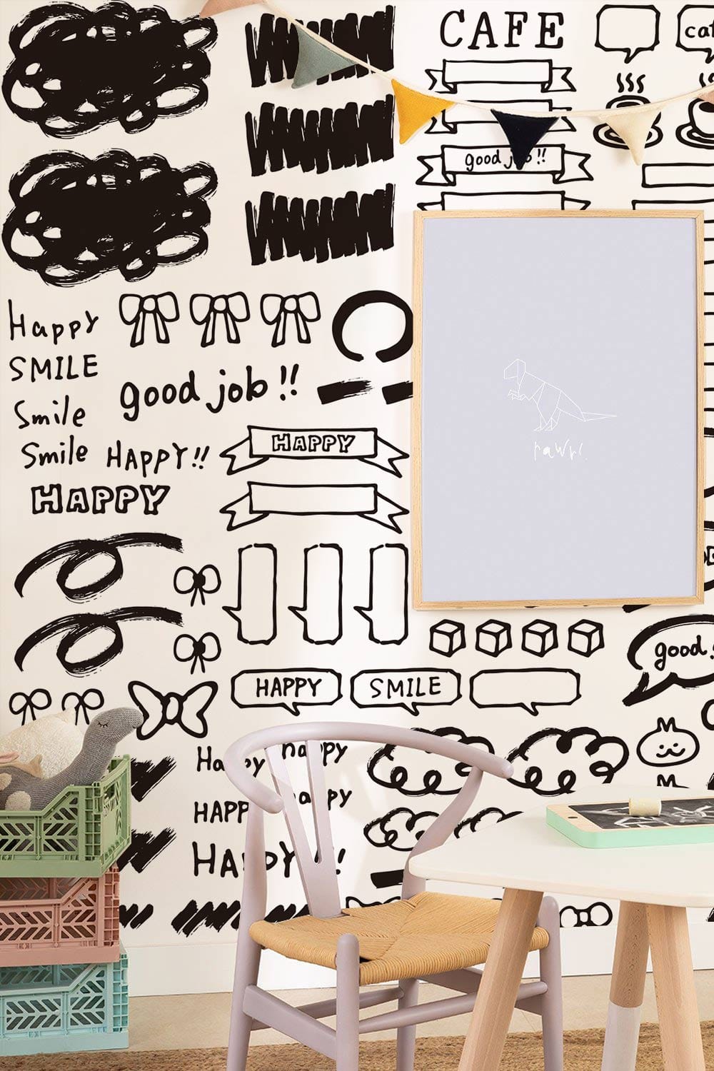 Monochrome doodle chaos mural wallpaper, modern nursery, wooden chair, pastel storage boxes.