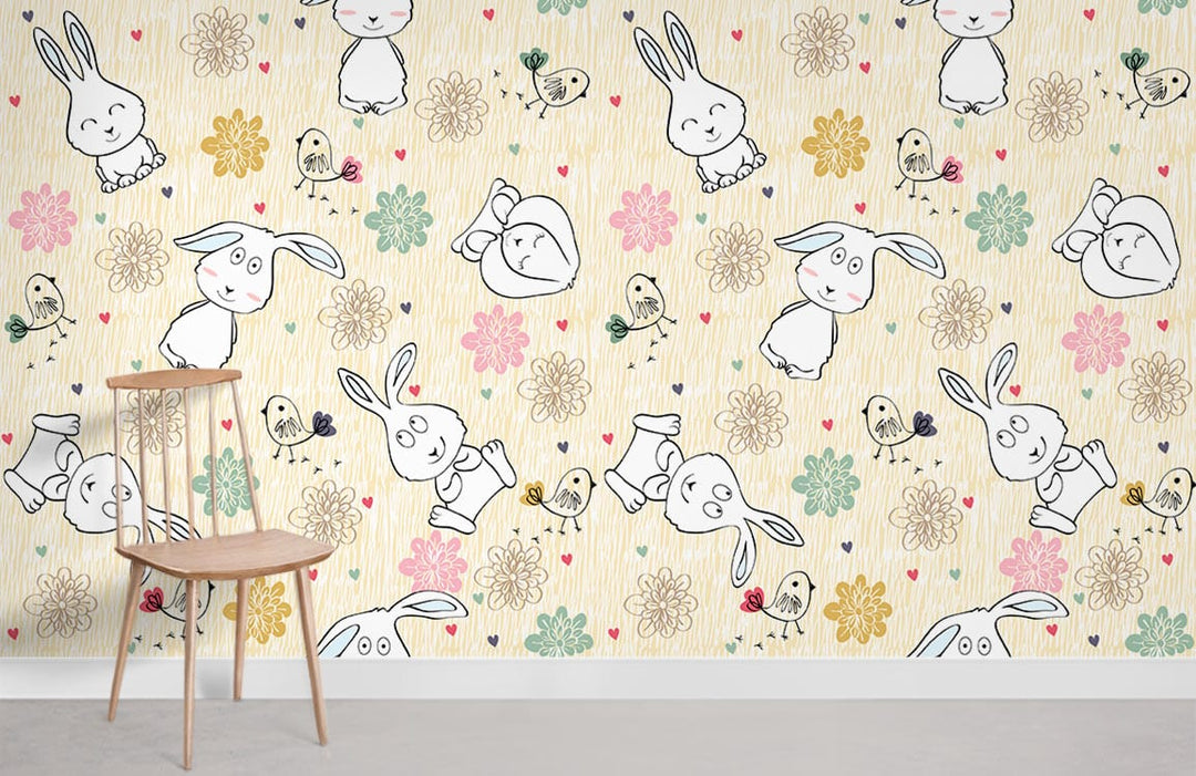 Nursery wallpaper with pastel bunnies and flowers, wooden chair, light beige wall, and grey floor.