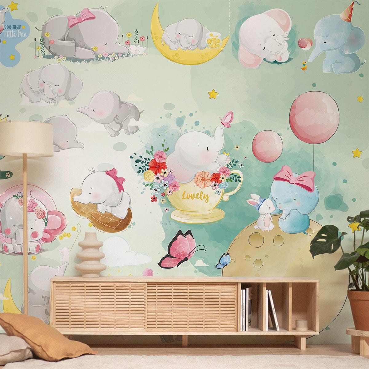 Adorable Pastel Elephant Nursery Mural Wallpaper featuring stars, balloons, and wooden sideboard in child's room.
