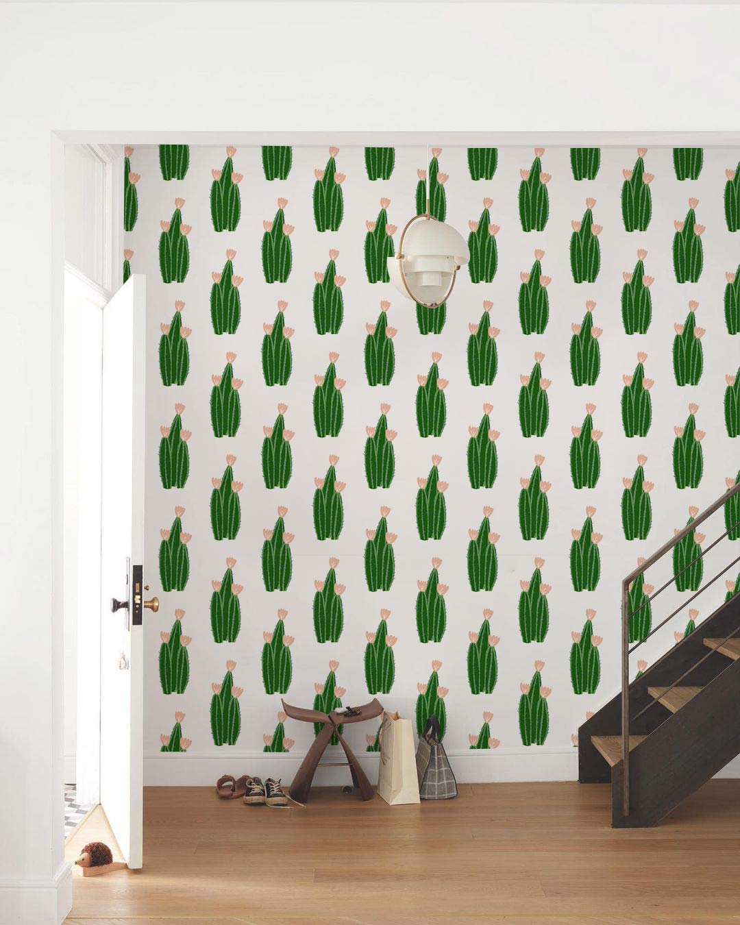 Enchanting green cacti wallpaper in modern hallway with wooden flooring, and minimalist stairs.