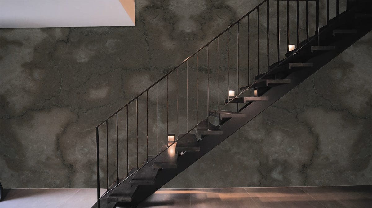 Grey Textured Marble Effect Mural Wallpaper behind sleek modern staircase, enhancing elegant interior design.