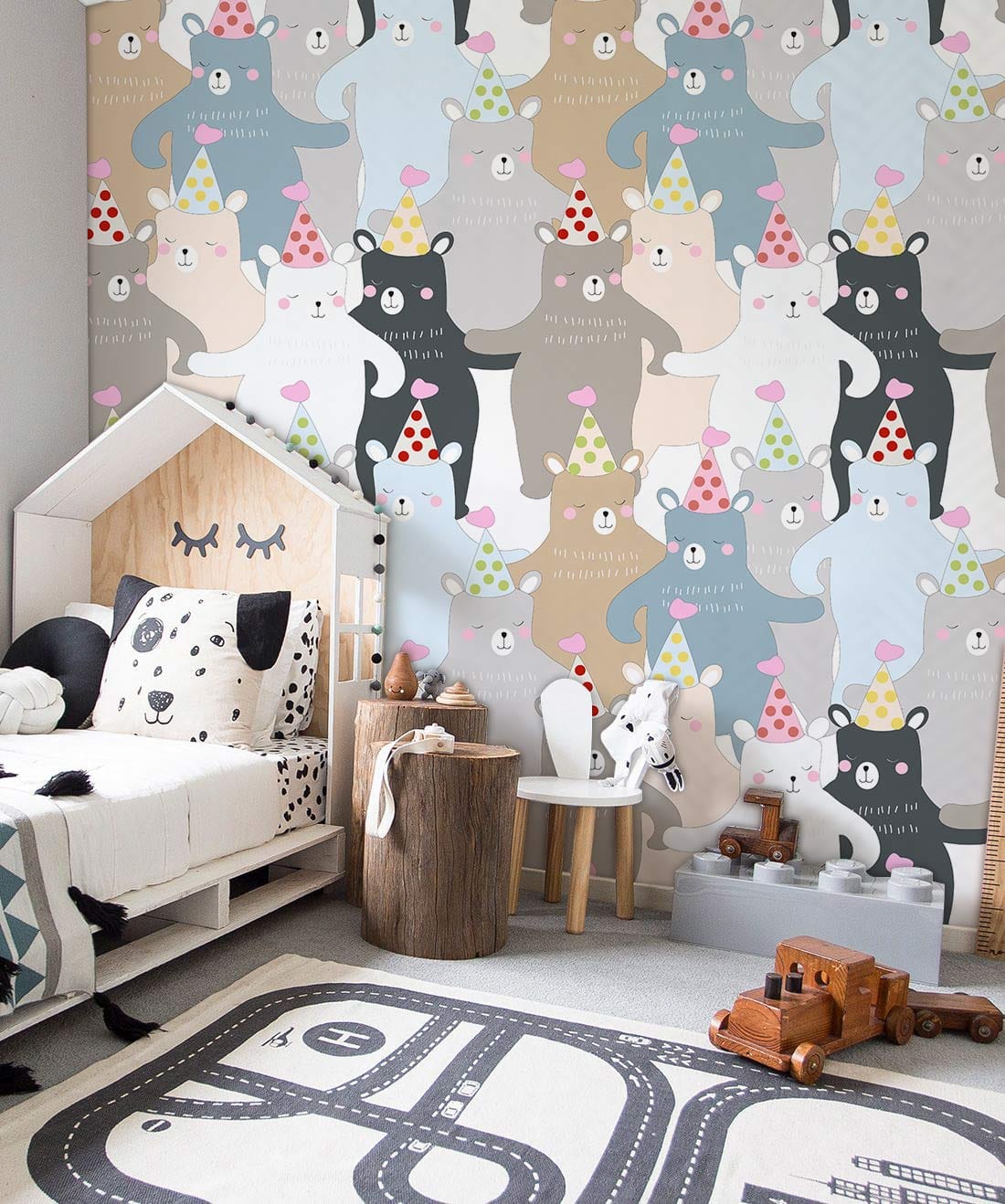 Whimsical Bears Party wallpaper in children's room with wooden bed, play furniture, and playful decor.