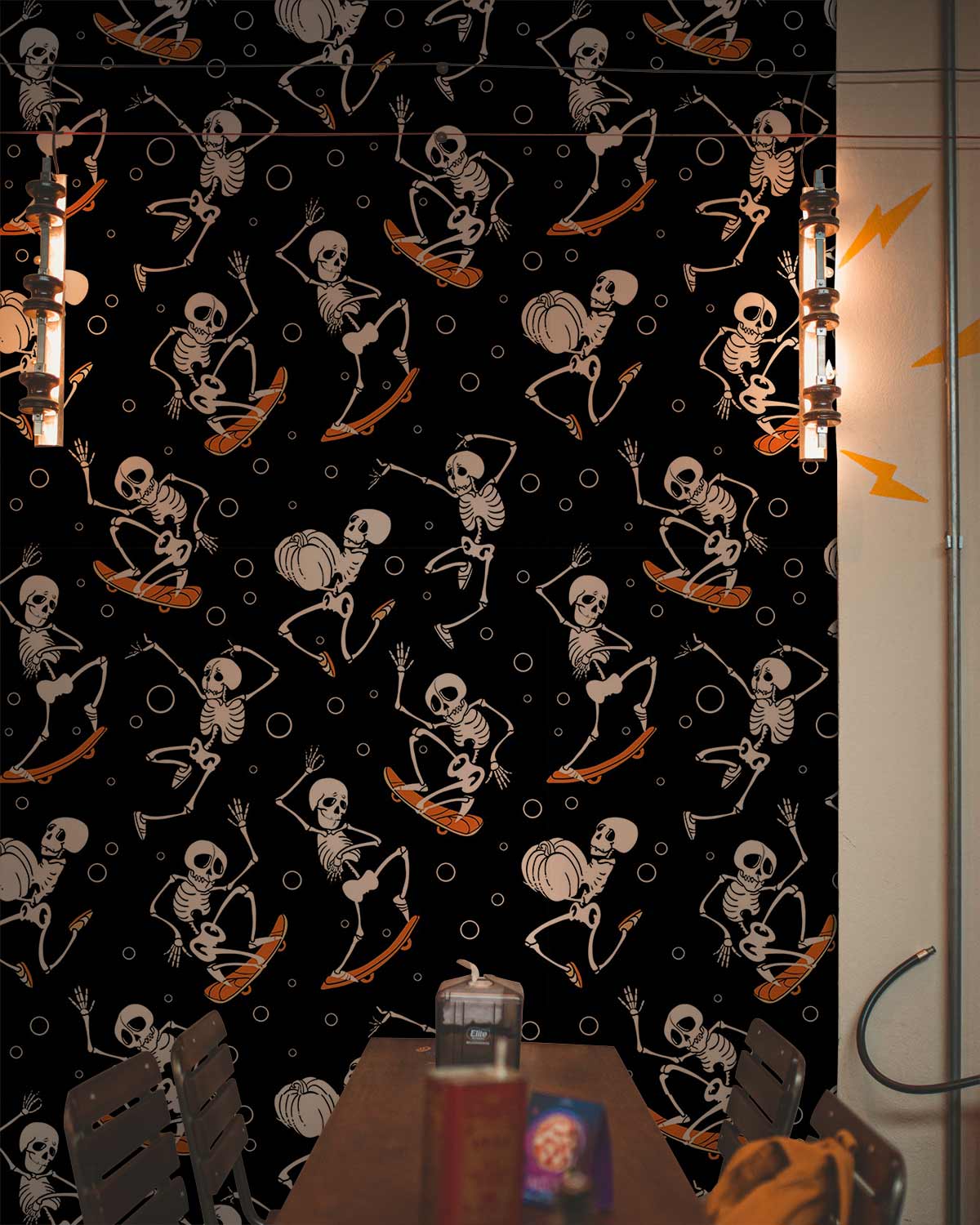 Playful skeleton skateboard wallpaper with Halloween patterns, industrial lights, and dark wood table in dining room.