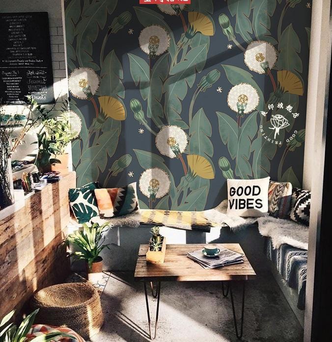 Vintage Botanical Dandelion Dark Green Floral Wallpaper in cosy seating area with modern wooden table.
