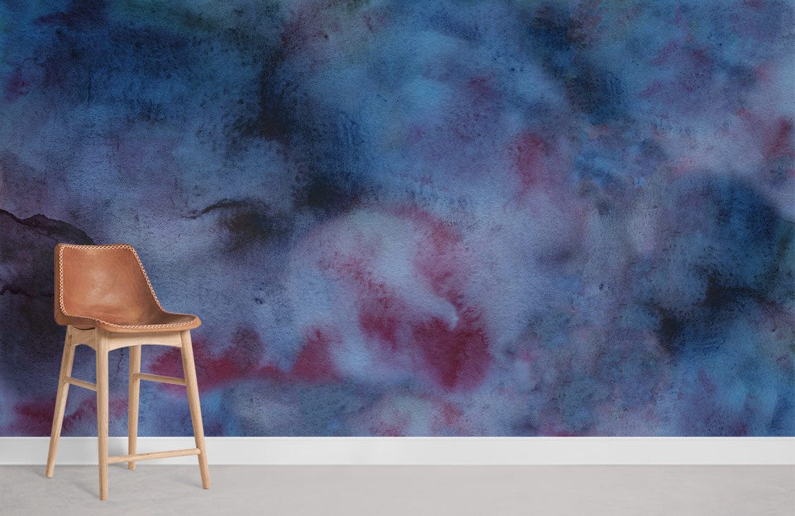 Abstract watercolour dreamscape mural wallpaper with moody blue, red hues, leather chair, modern interior design.