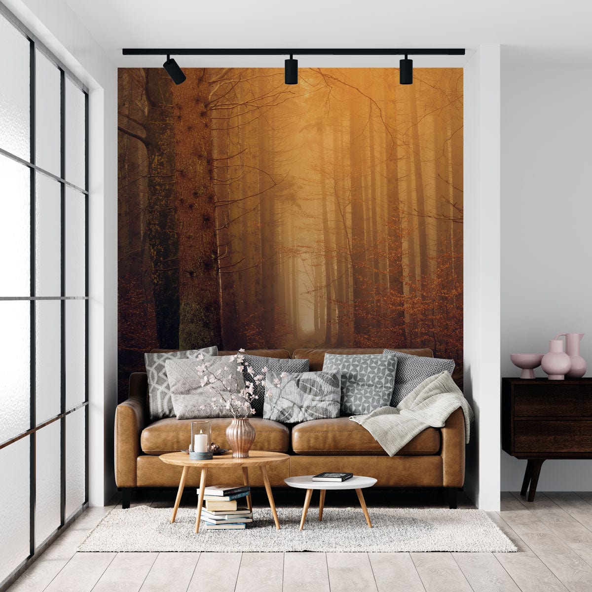 Enchanted Autumn Forest Mural, earthy tones, misty glow, brown sofa, wooden flooring, living room.