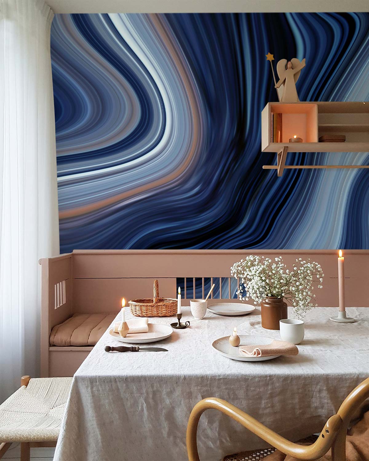 Elegant blue marble swirl mural wallpaper in dining room with beige bench, white curtains, and wooden chair.