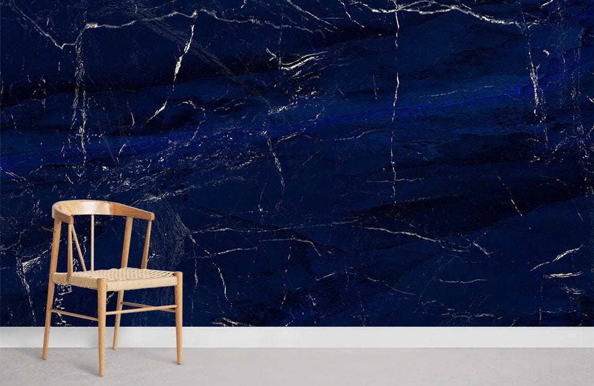 Luxurious wall mural with midnight blue marble effect, wooden chair, grey flooring, elegant interior design.