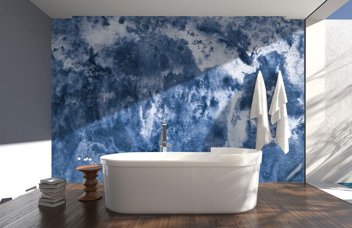 Modern bathroom with Indigo Watercolour Abstract Mural Wallpaper, featuring a white bathtub and wooden flooring.