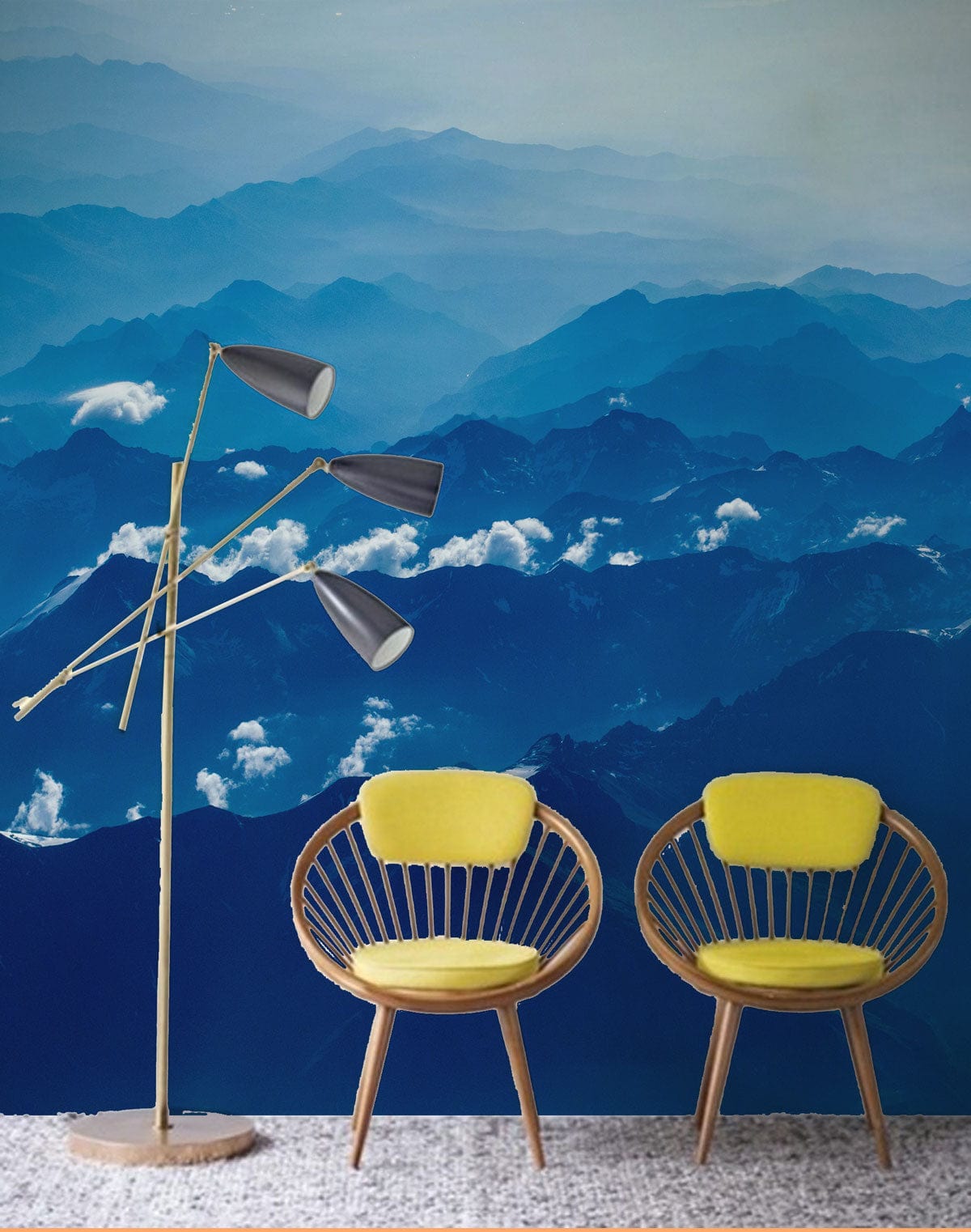 Serene Blue Mountain Landscape Mural Wallpaper with yellow chairs, modern floor lamp, textured flooring.