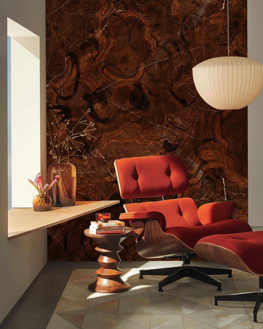 Luxurious dark marble wallpaper with rust chair, pendant light, modern flooring in elegant living room.