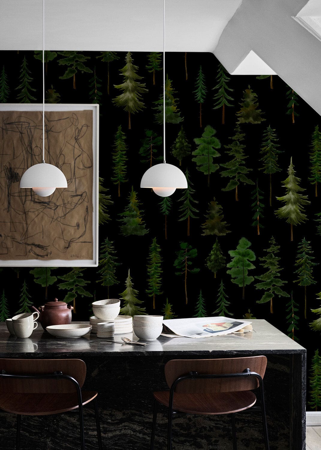 Dark forest wallpaper with evergreen trees, marble table, minimalistic pendant lights, modern art in dining area.