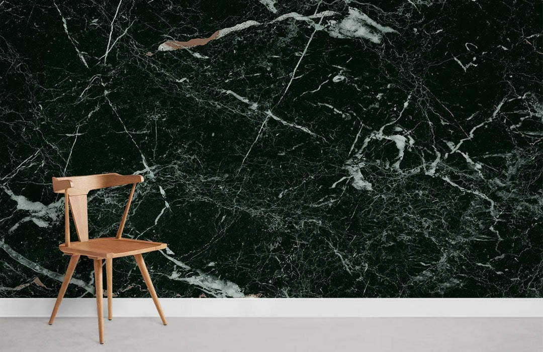 Luxurious black marble effect wallpaper with white veining, wooden chair, minimalist interior style.