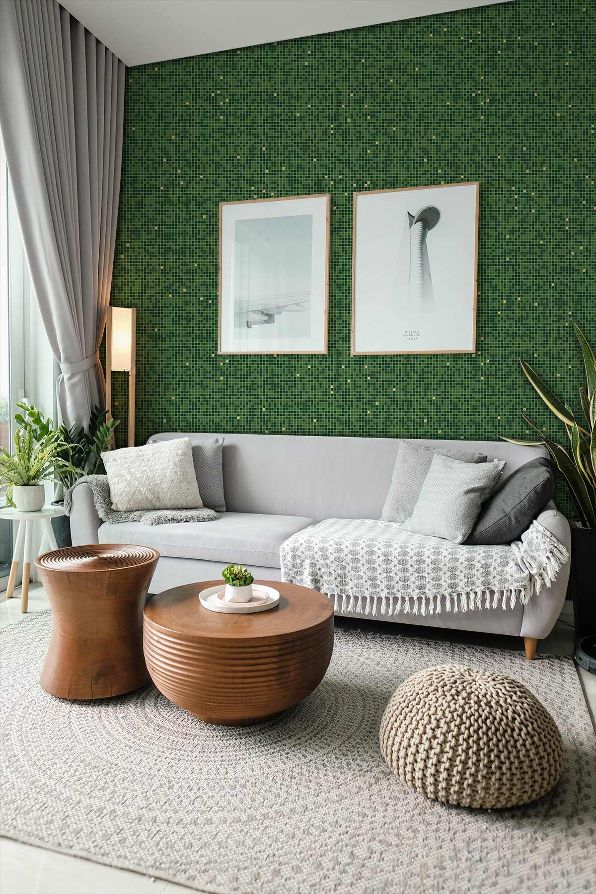Modern living room with elegant green speckled wallpaper, grey sofa, wooden tables, and stylish decor.