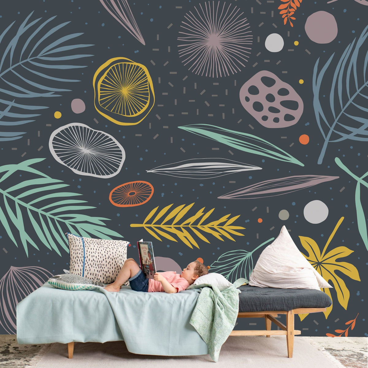 Vibrant mural wallpaper with tropical foliage, deep blue tones, modern sofa, cozy lounge room setting.
