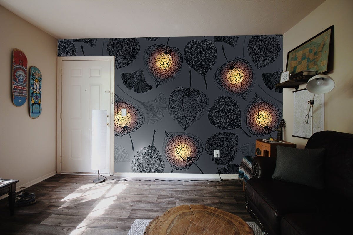 Elegant grey botanical wallpaper with lantern pattern in living room, dark sofa, wooden flooring.