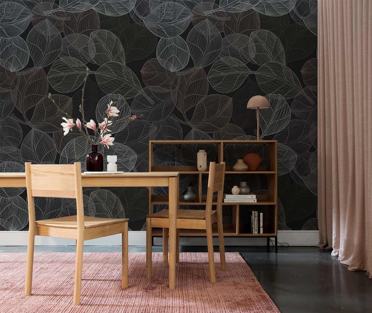 Elegant dark leaf pattern wallpaper in earthy tones, wooden dining furniture, pink rug, minimalist decor.