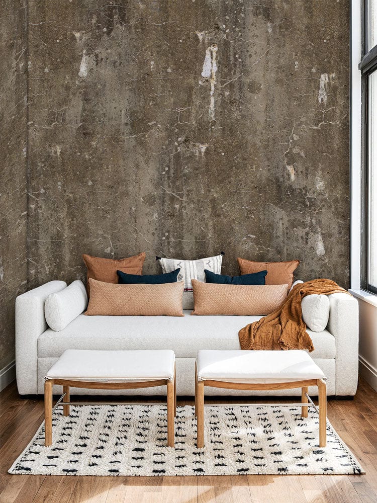 Vintage industrial concrete wallpaper, white sofa, wooden flooring, earthy distressed wall, modern living room.