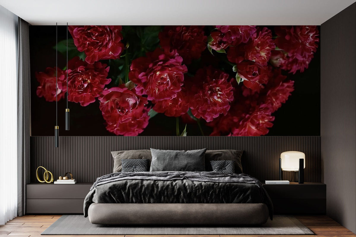 Elegant Crimson Rose Blossom wallpaper in luxurious bedroom with dark decor, plush grey bedding, hardwood floor.