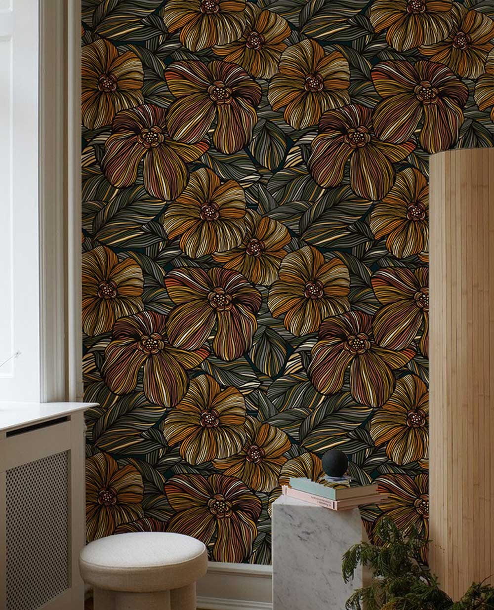 Autumnal botanical wallpaper with floral design, earthy tones; stylish interiors, featuring cream stool, marble pedestal.