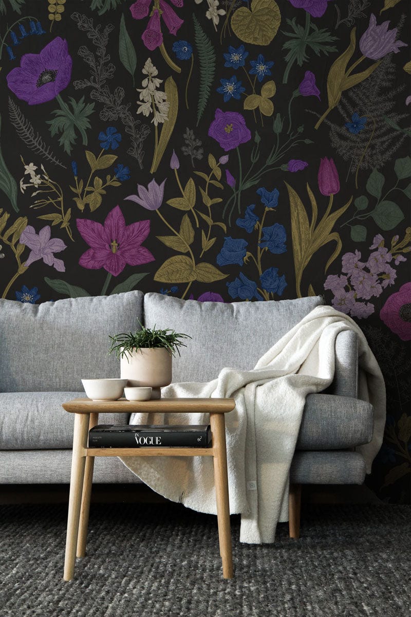 Botanical Bliss Wallpaper with grey sofa, wooden table, and rug in living room setting.