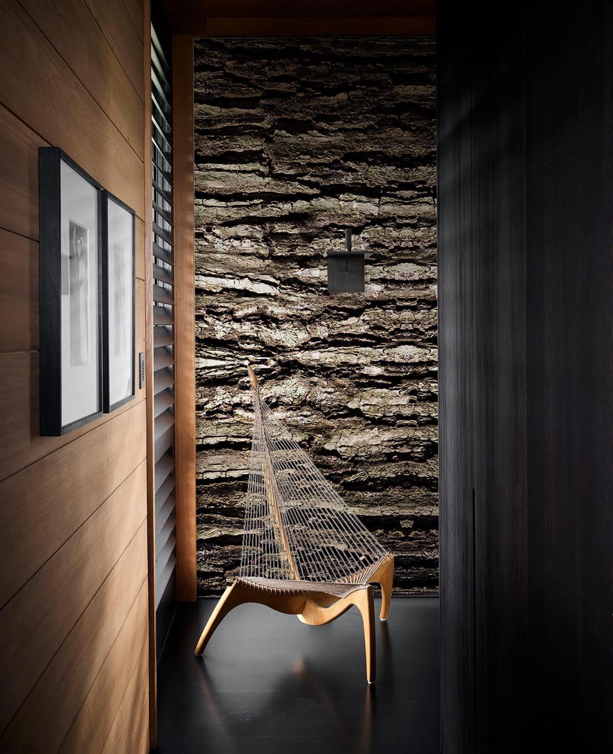 Rustic Textured Bark Effect Wallpaper in narrow hallway, featuring sleek modern chair, dark flooring.