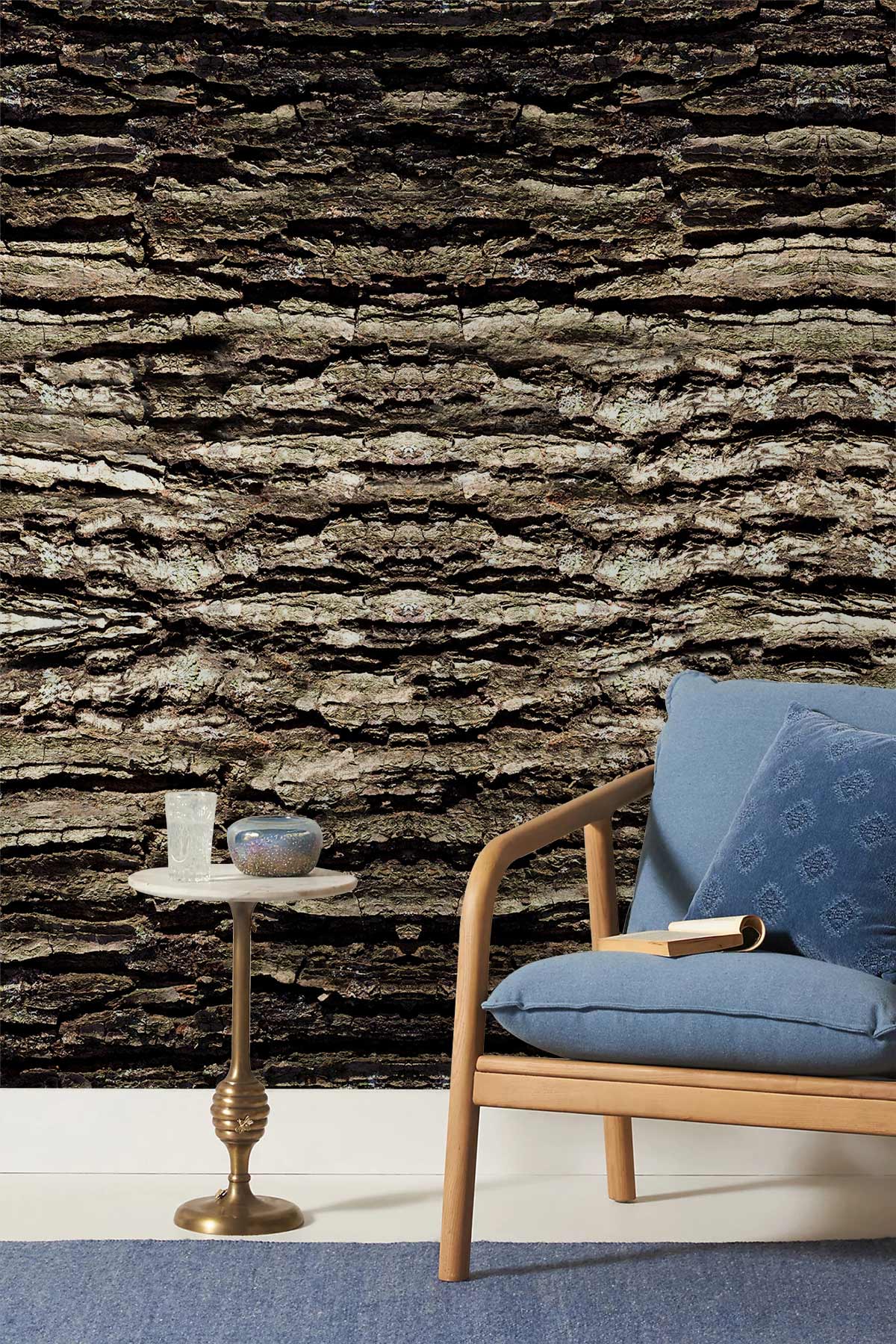 Rustic Textured Bark Effect Wallpaper in living room with blue sofa, wood frame, ornate side table.