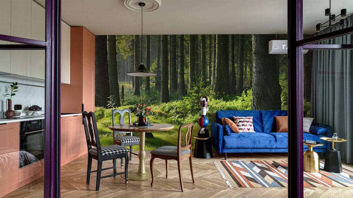 Tranquil Green Forest Scene Mural in living room, blue sofa, wooden flooring, modern interior design.