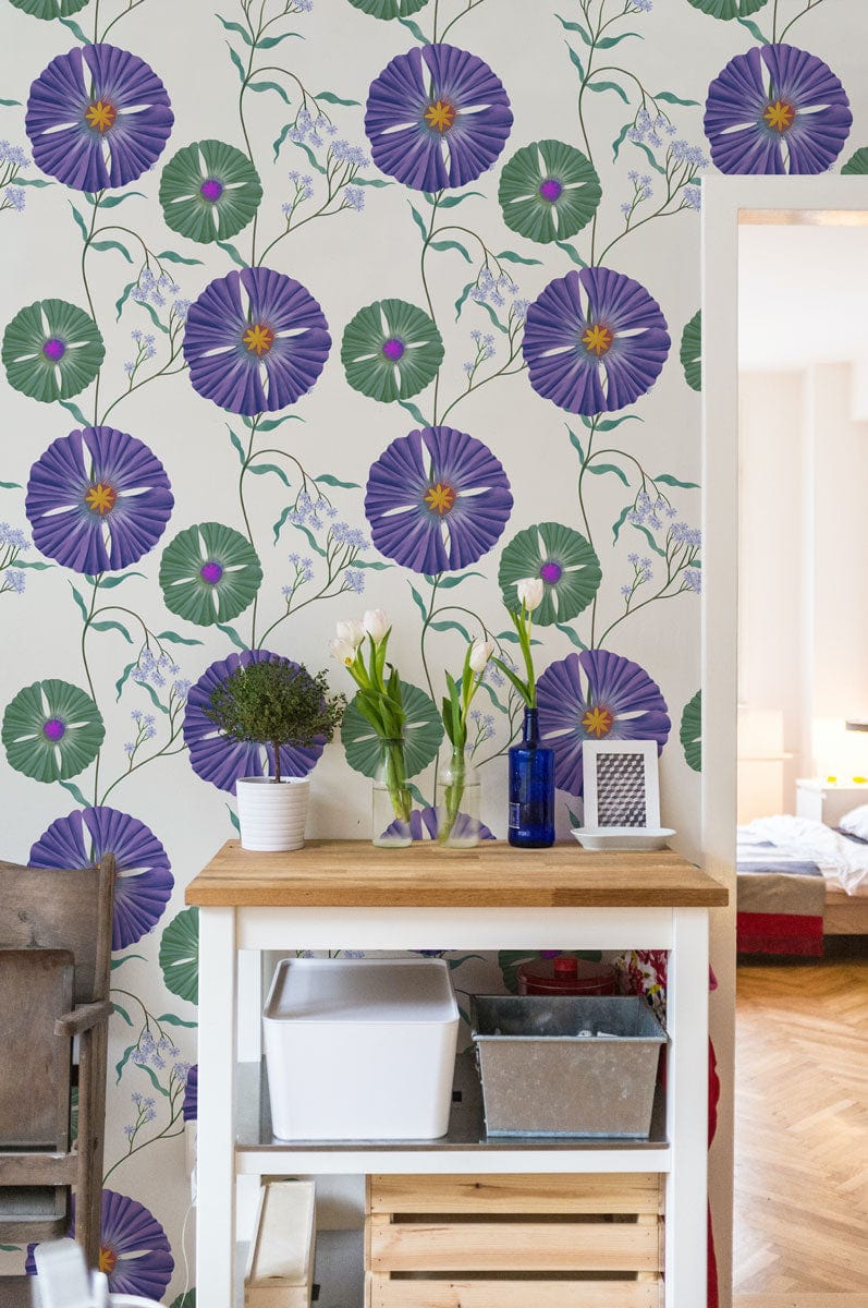 Vintage purple floral wallpaper, green accents, elegant interior; wooden furniture, parquet flooring, room decor.