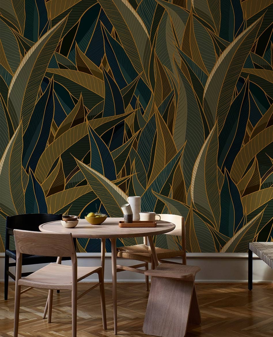 Art Deco Midnight Jungle Leaf Pattern Wallpaper in teal and gold, dining room, wood flooring, modern chairs.