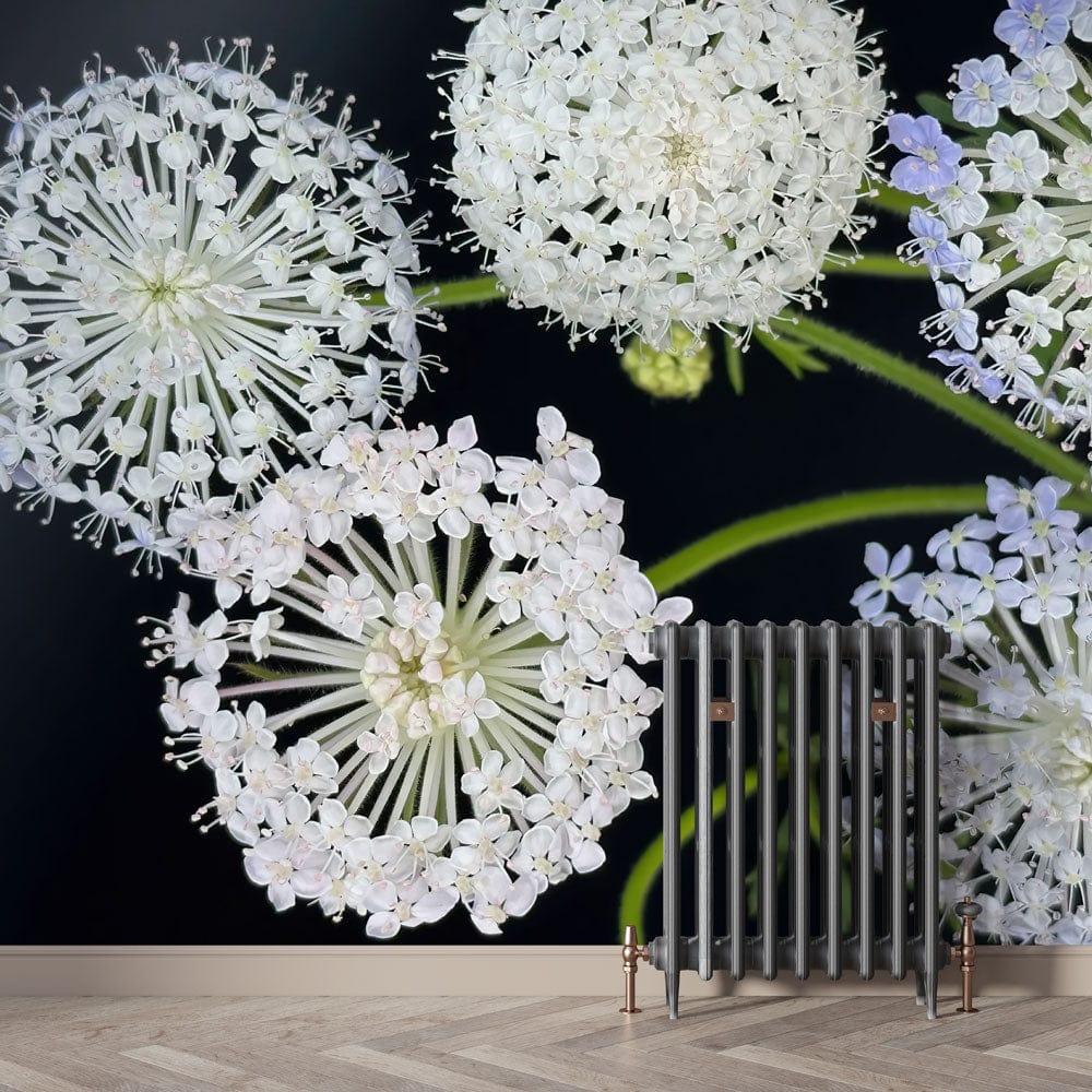 Elegant floral mural wallpaper with white and lavender hues, featuring dark background and wooden flooring.