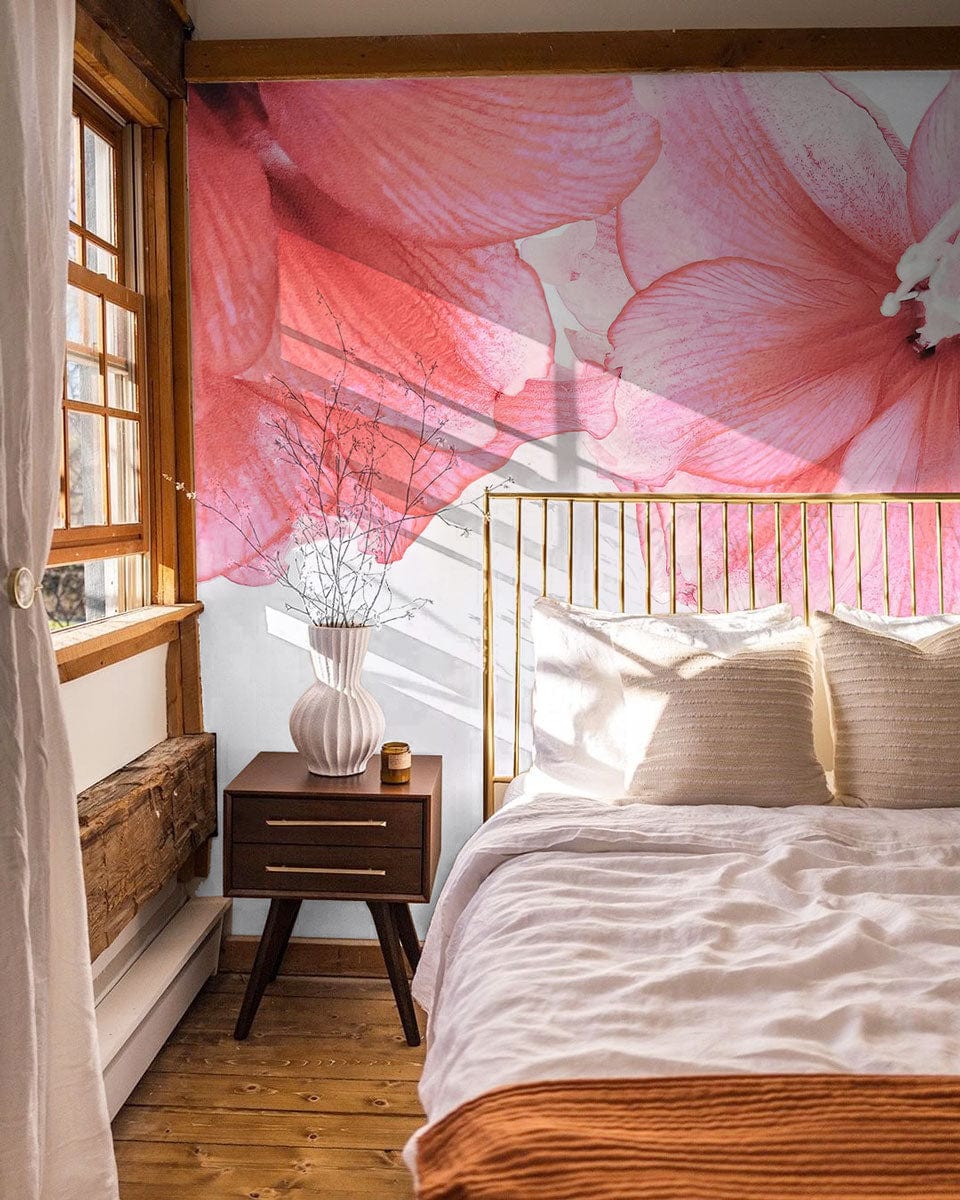 Elegant Pink Floral Blossom Wall Mural in bedroom with gold bedframe, wooden flooring, and modern furnishings.