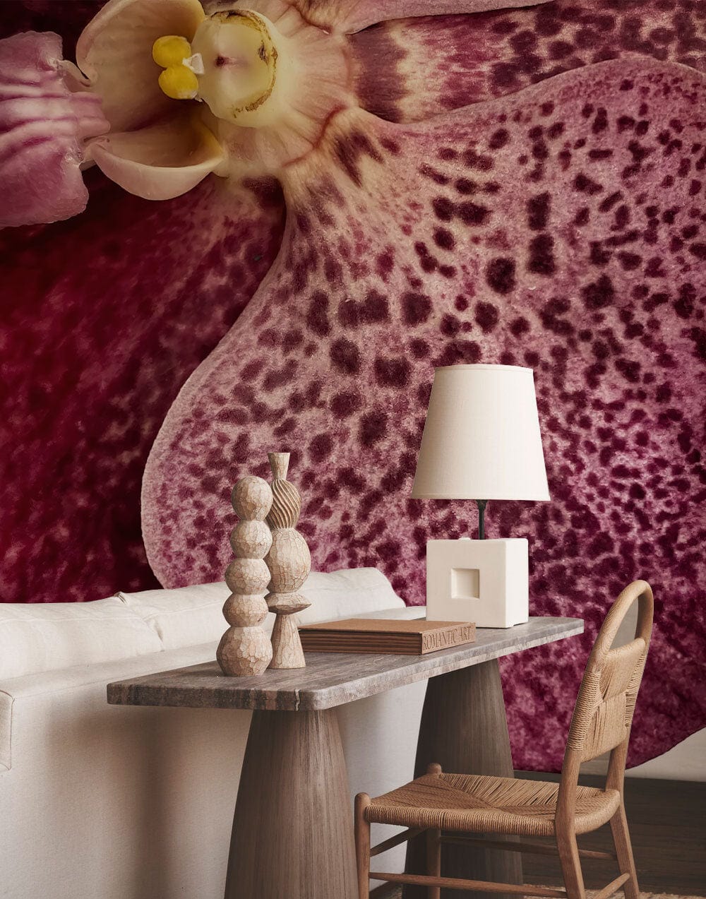 Rich burgundy floral wallpaper with white sofa, wooden table, and chair for luxurious living spaces.