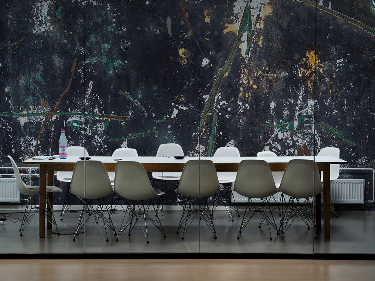Abstract grunge wallpaper backdrop in a modern dining room with white chairs and wooden table.