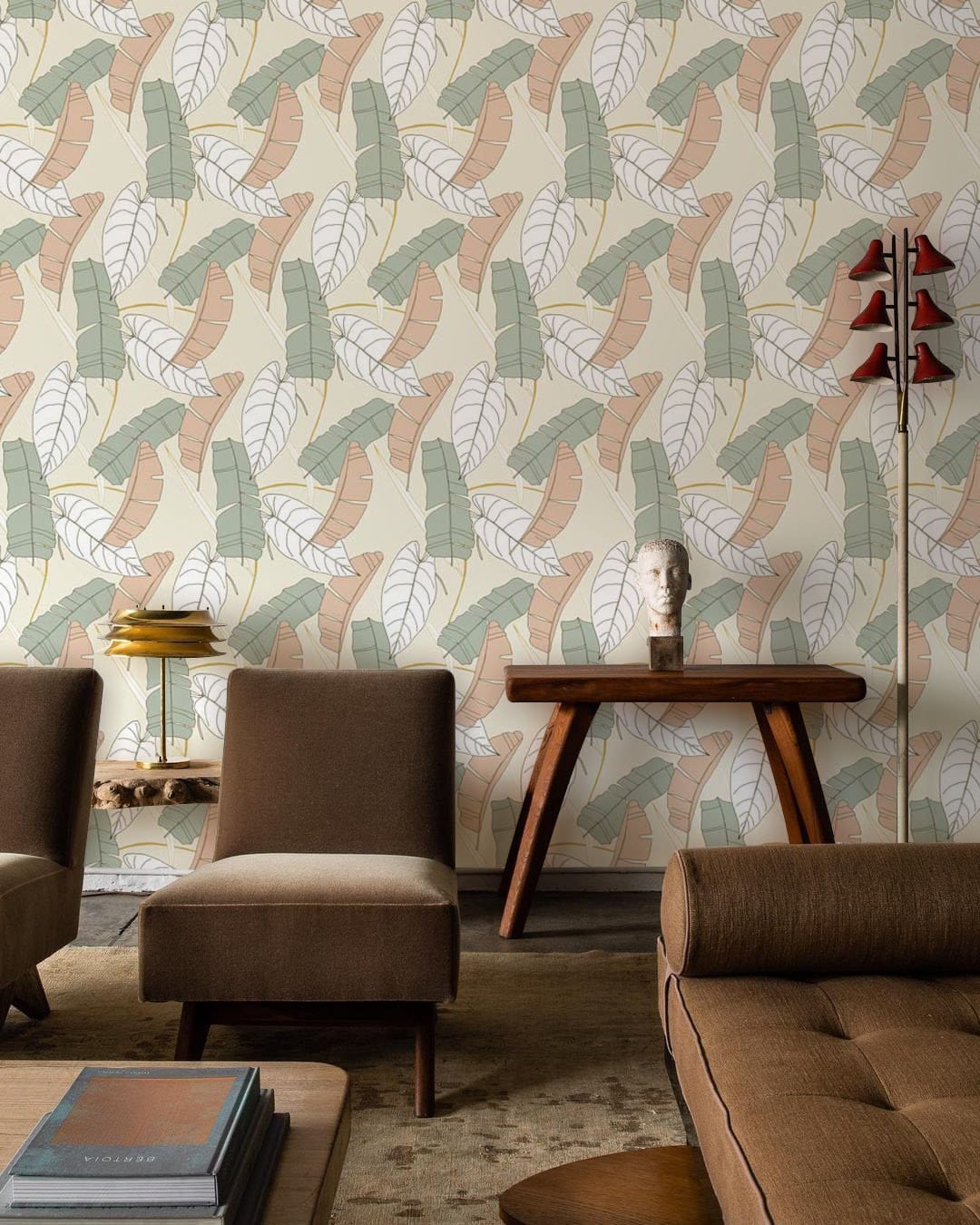 Botanical Pastel Leaf Pattern Wallpaper in soft green with beige. Brown chairs, modern table, and rug.