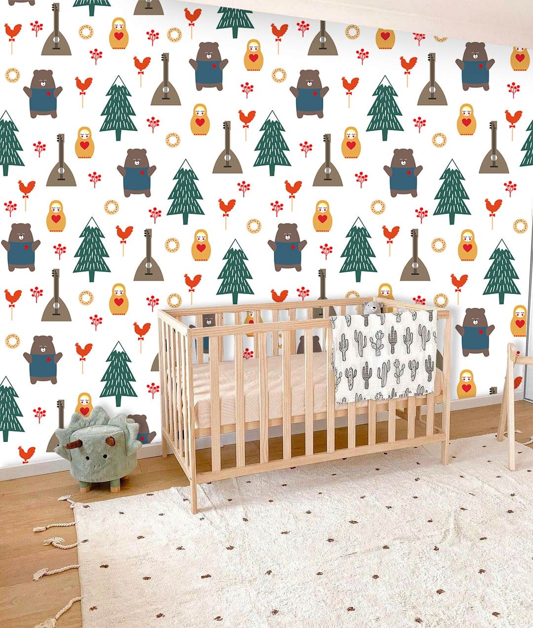 Children's nursery with forest wallpaper, wooden cot, tree motif, bear plush, and hardwood flooring.