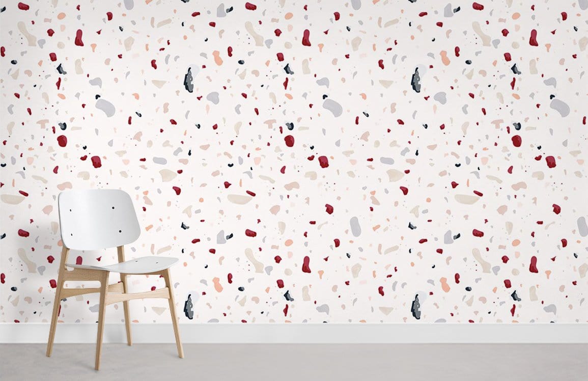 Modern Terrazzo Pattern Wallpaper in cream and red, speckled design with simple white wooden chair.