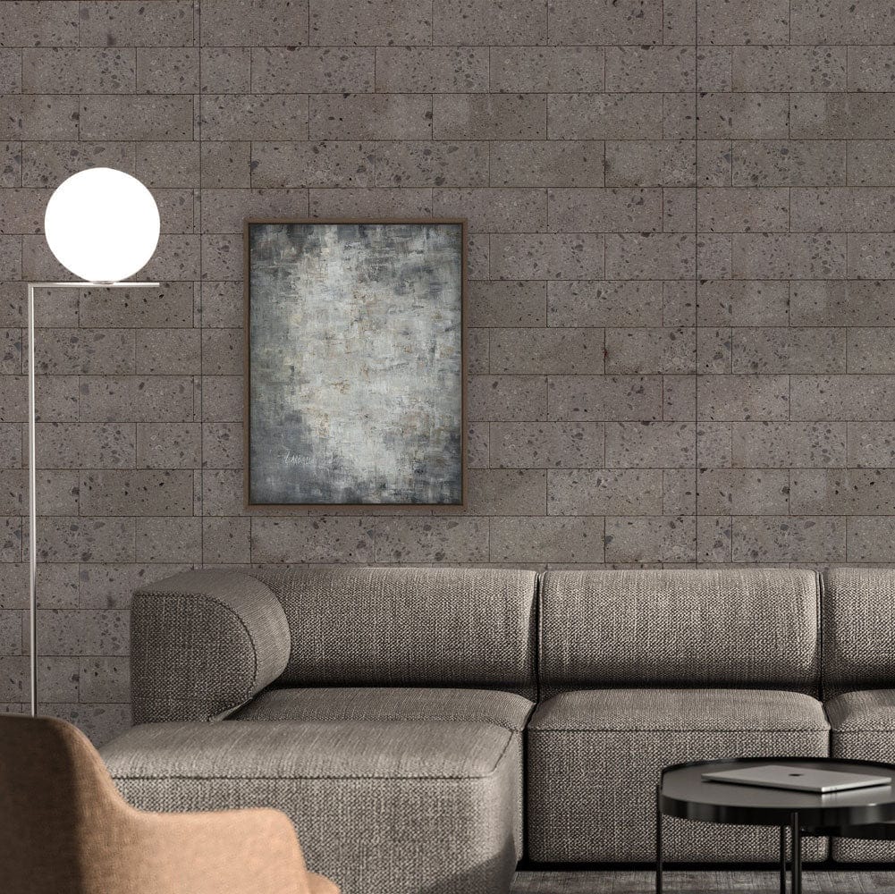 Grey Brick Wallpaper with grey sectional sofa, industrial lamp, abstract art, and dark coffee table.