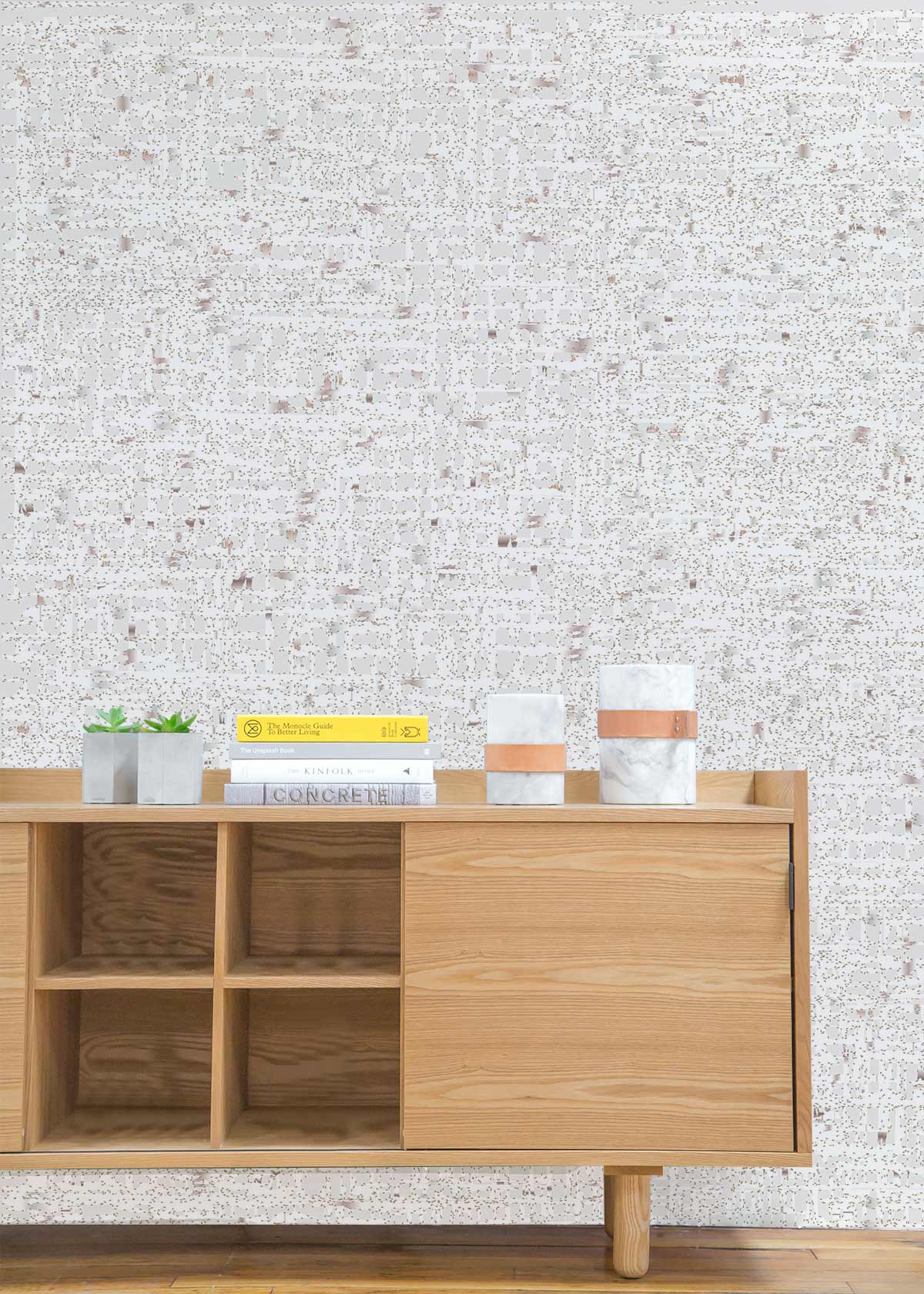 Elegant cream speckled wallpaper, modern minimalist design, wooden sideboard, hardwood flooring, living room setting.
