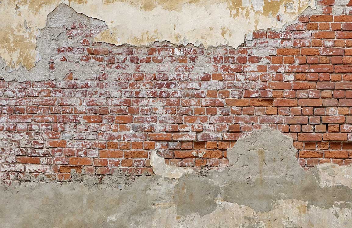 Vintage Exposed Brick and Plaster Effect Mural Wallpaper in Rustic Red