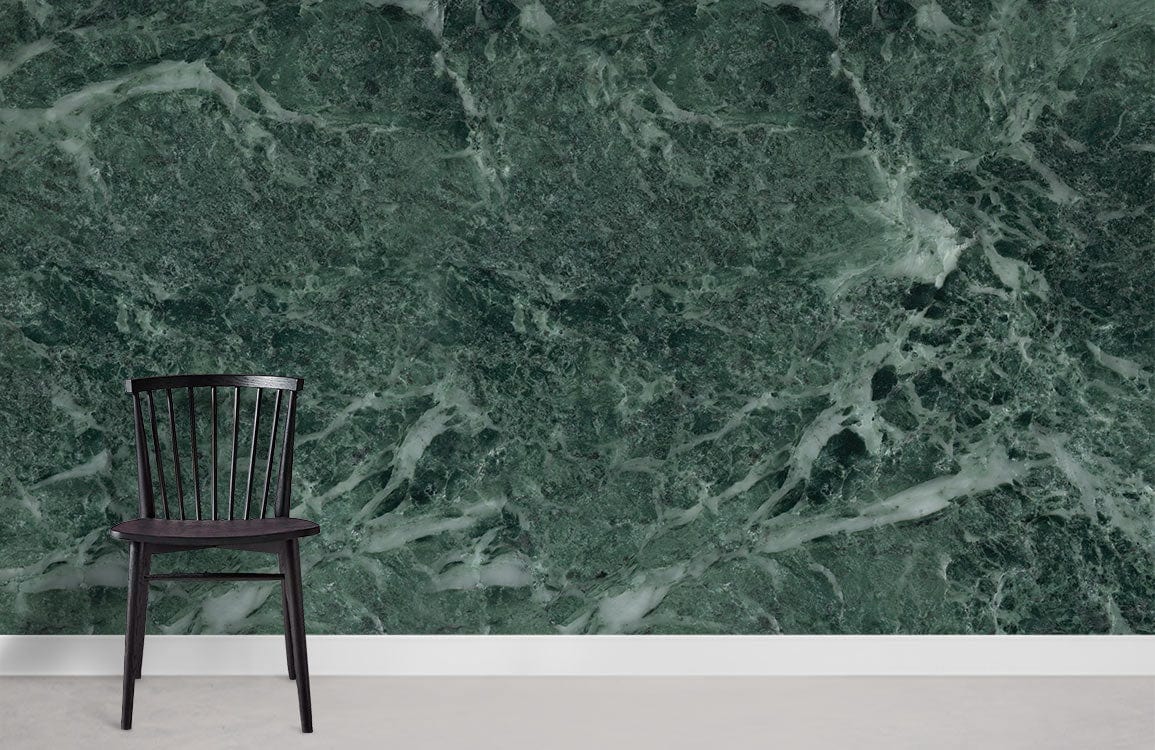 Emerald green marble effect mural wallpaper with sophisticated finish, black chair, grey flooring.
