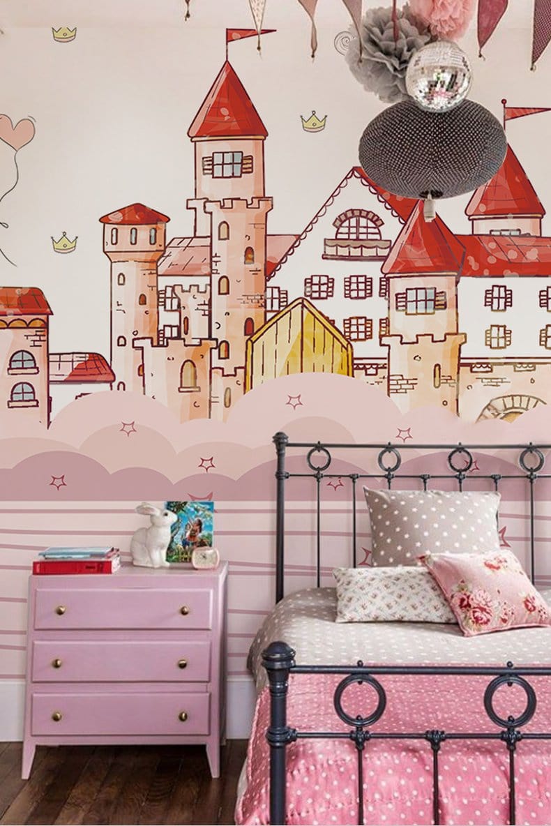 Pink castle fantasy mural in children's room with pink dresser, polka dot bedding, and hardwood flooring.