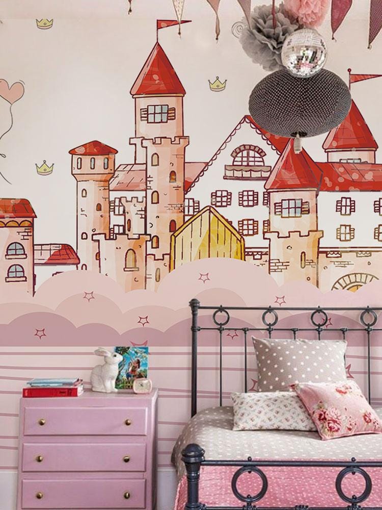Whimsical Pink Castle Mural Wallpaper in child's room with iron bed, pink drawers, and decorative items.