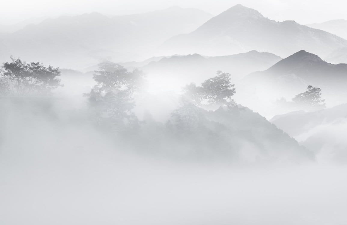 Ethereal Misty Mountain Landscape Mural Wallpaper in Calming Grey Tones