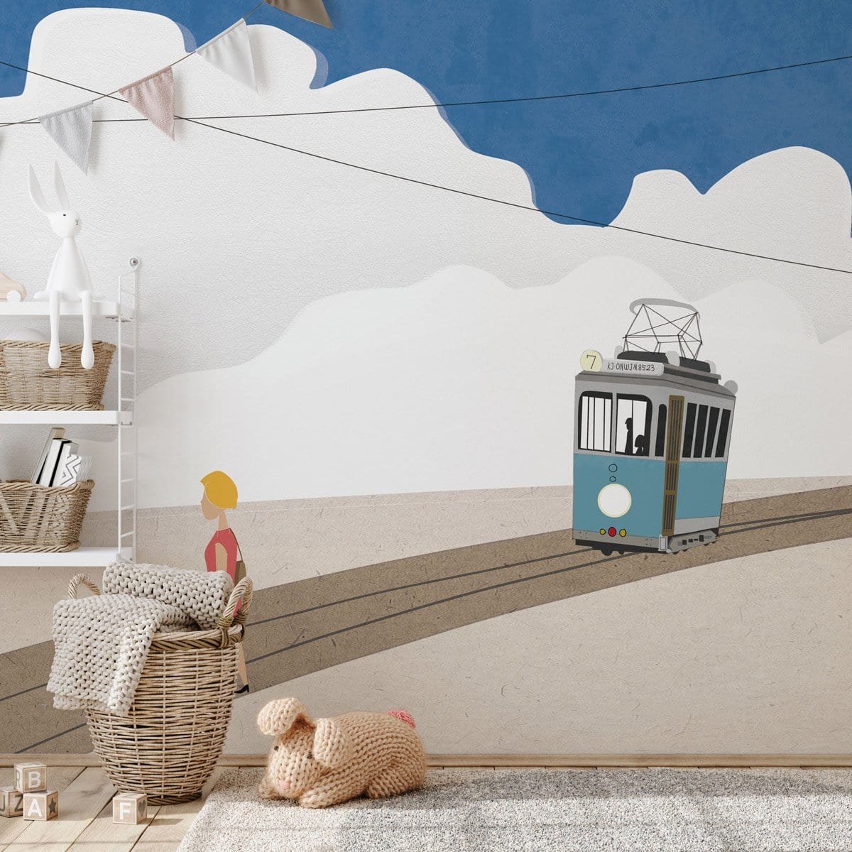 Vintage blue and beige tram mural wallpaper in children's room with plush rug and woven basket accents.