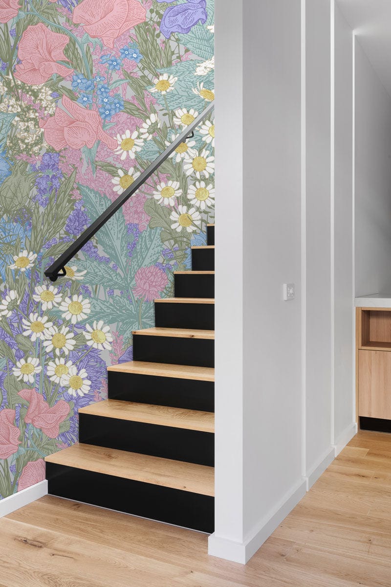 Vintage Pastel Floral Garden Wallpaper with pink, blue, green design beside modern wooden staircase.