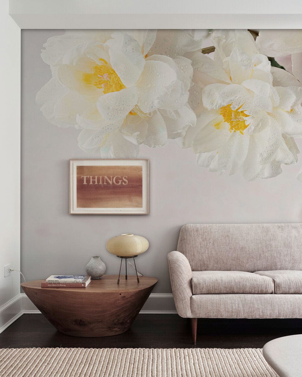 Elegant White Floral Blossom Mural Wallpaper in soft pastel, beige modern sofa, dark wood coffee table.